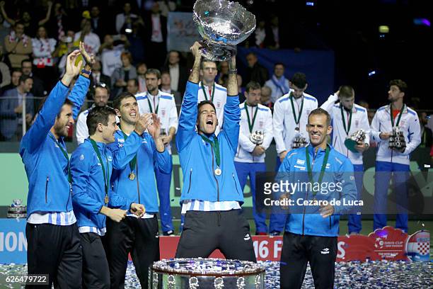 Leonardo Mayer, Guido Pella, Federico Del Bonis, Juan Martin Del Potro of Argentina and Argentina team captain Daniel Orsanic celebrate with their...