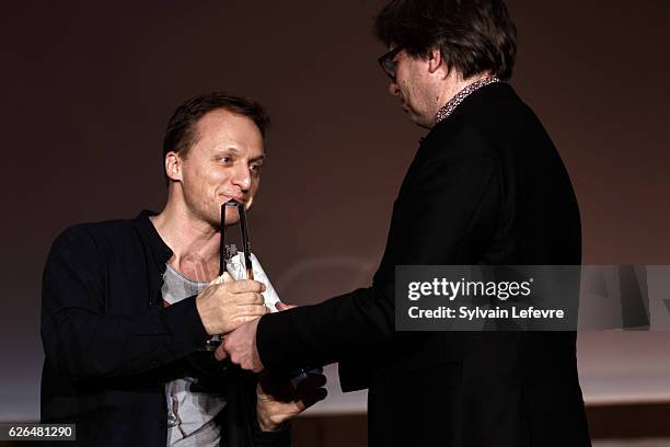 Russian actor Vladimir Mishukov, receives the winner of the Best Actor award, during Russian Film Festival on November 26, 2016 in Honfleur, France.