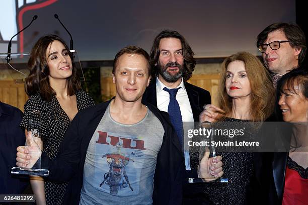 Russian actor Vladimir Mishukov , Best Actor award, poses with jury members Victoria Olloqui, Frederic Beigbeder, Cyrielle Clair, Philippe Rouyer and...