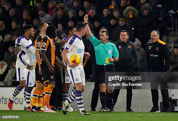 Dieumerci Mbokani of Hull City is shown a red card by referee Neil Swarbrick and is sent off during the EFL Cup Quarter-Final match between Hull City...