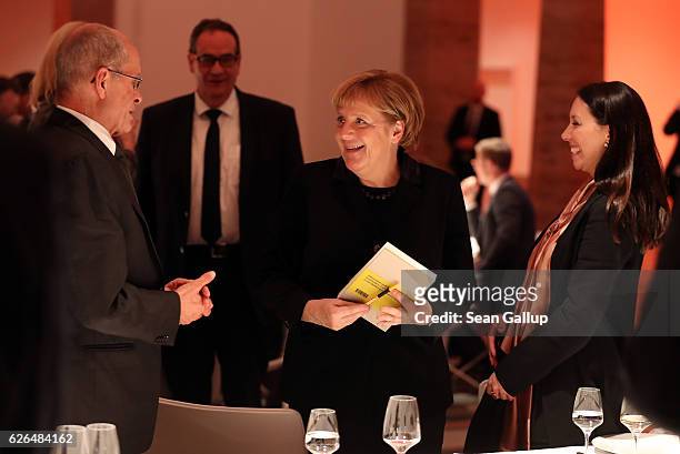 German Chancellor Angela Merkel attends the gala event of the 200th birthday of Werner von Siemens next to Berthold Huber, president of the Siemens...