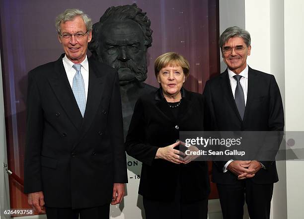 German Chancellor Angela Merkel poses in front of the bust of Werner von Siemens with Joe Kaeser, president and CEO of Siemens AG , and Gerhard...