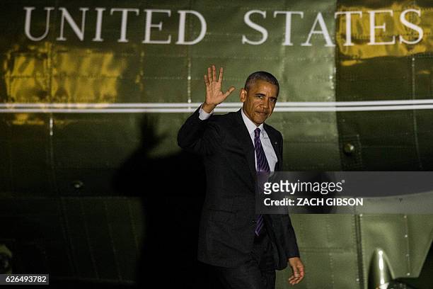 President Barack Obama waves as he arrives at the White House November 29, 2016 in Washington, D.C. President Obama traveled to Walter Reed National...