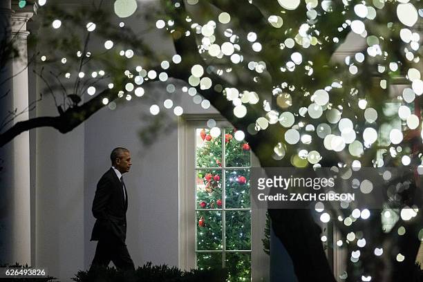 President Barack Obama walks to the Oval Office after arriving at The White House November 29, 2016 in Washington, D.C. President Obama traveled to...