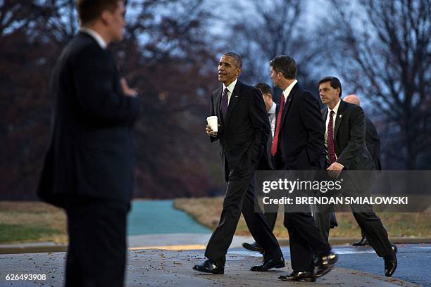 President Barack Obama walks with his physician Dr. Ronny Jackson to Marine One after visiting with troops at Walter Reed National Military Medical...