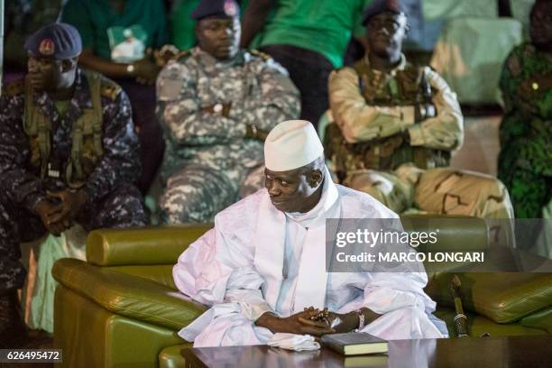 Incumbent Gambian President Yahya Jammeh looks on in Banjul on November 29 during the closing rally of the electoral campaign of the Alliance for...