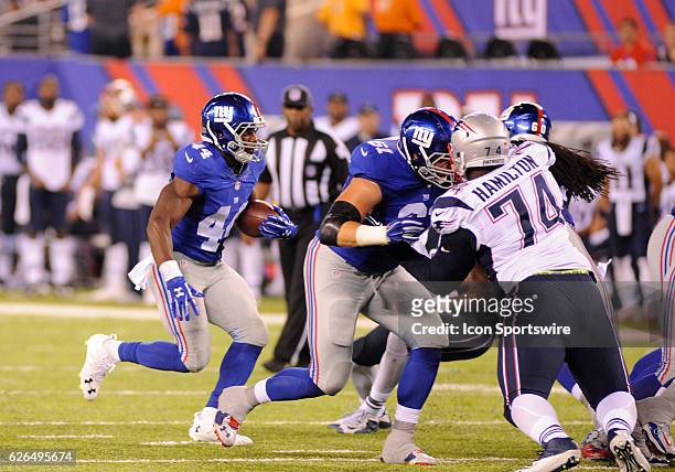 New York Giants Running Back Andre Williams [11449] rushes the ball up the middle during pre season action against the New England Patriots. The...