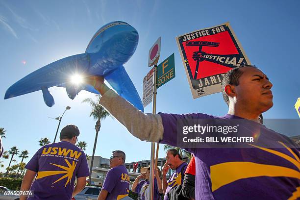 Some 200 low-wage workers take part in a protest named "Day of Disturbance" to demand higher wages on November 29, 2016 at San Diego International...