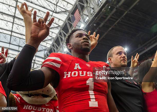 Houston Cougars quarterback Greg Ward Jr. And Houston Cougars head coach Tom Herman sing the school song during the AdvoCare Texas Kickoff football...