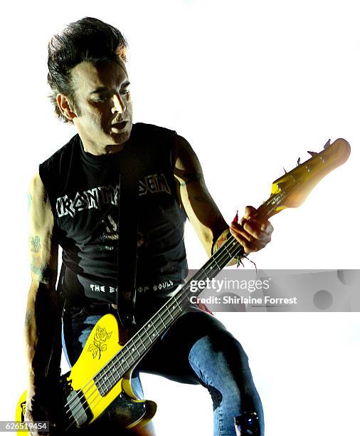 Simon Gallup of The Cure performs at Manchester Arena on November 29, 2016 in Manchester, United Kingdom.