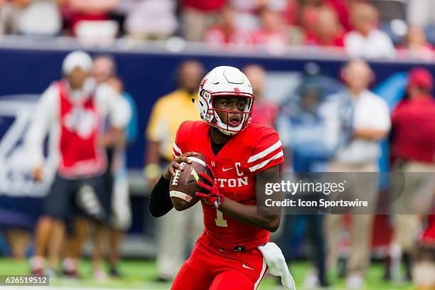 Houston Cougars quarterback Greg Ward Jr. Looks down field in first half of action during a Advocare Texas Kickoff football game between the Houston...