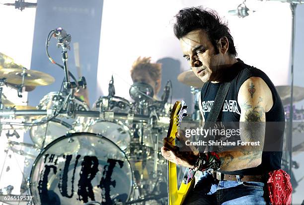 Simon Gallup of The Cure performs at Manchester Arena on November 29, 2016 in Manchester, United Kingdom.