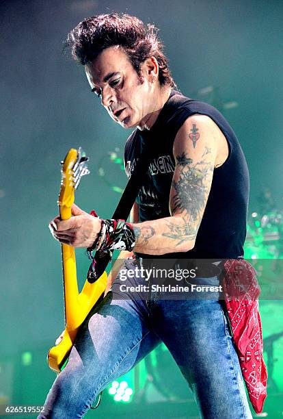 Simon Gallup of The Cure performs at Manchester Arena on November 29, 2016 in Manchester, United Kingdom.