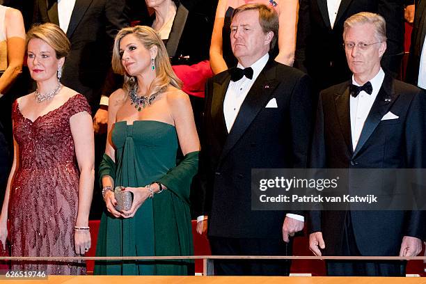 From L toR: Queen Mathilde, Queen Maxima, King Willem-Alexander and King Philippe during the National anthems at the start of the concert offered by...