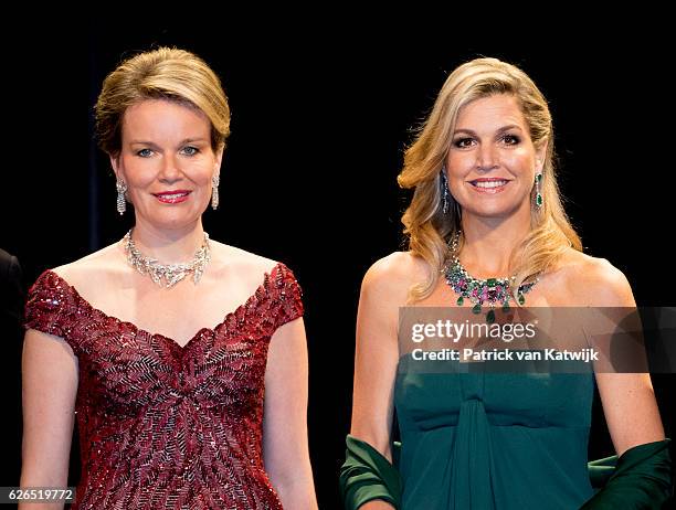 Queen Mathilde and Queen Maxima at the start of the concert offered by the Belgian King in the Muziekgebouw Aan't IJ Amsterdam on November 29, 2016...