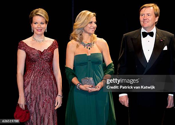 Queen Mathilde, Queen Maxima and King Willem-Alexander at the start of the concert offered by the Belgian King in the Muziekgebouw Aan't IJ Amsterdam...