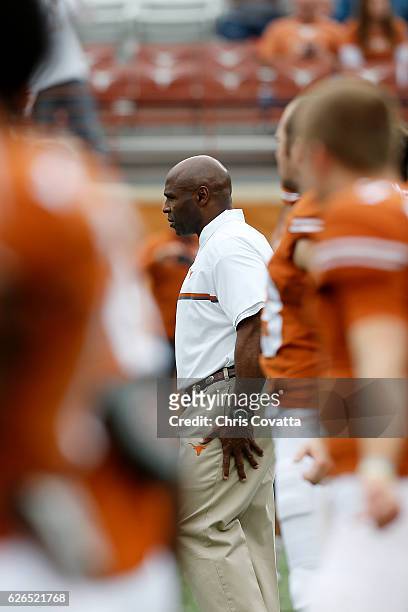 Head coach Charlie Strong of the Texas Longhorns stands on the field for the last time before the game against the TCU Horned Frogs at Darrell K...
