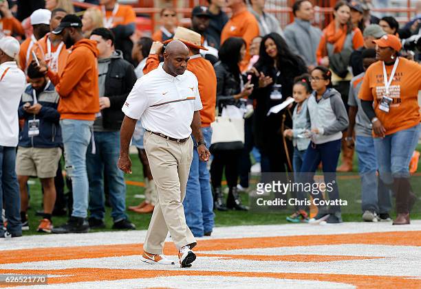 Head coach Charlie Strong of the Texas Longhorns walks on the field for the last time before the game against the TCU Horned Frogs at Darrell K Royal...