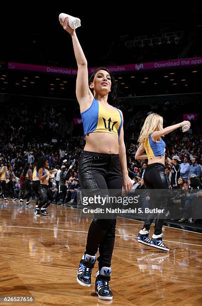 The Brooklynettes dancers perform during the Tshirt Toss during a game between the Los Angeles Clippers and the Brooklyn Nets on November 29, 2016 at...