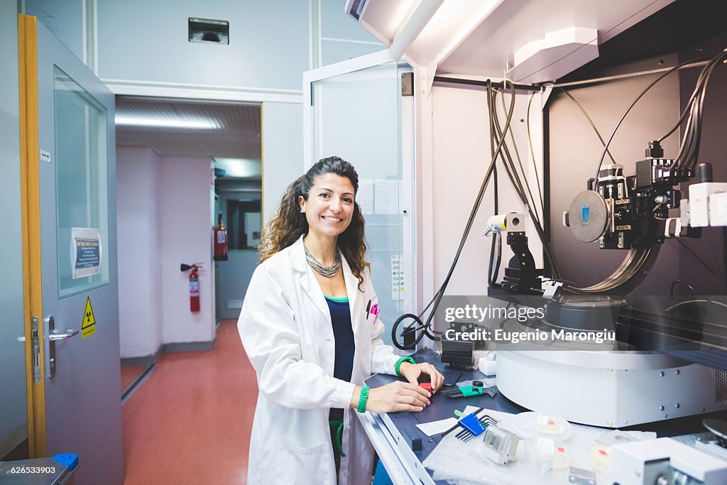 Female scientist preparing x-ray diffractometer