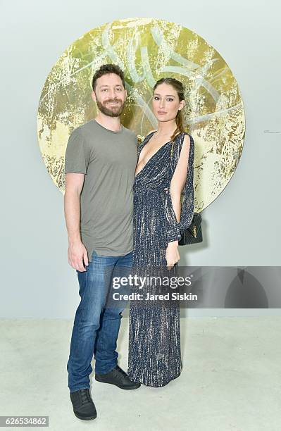 Yoni Benimetzky and actress Keirsten Kafka attend the Jose Parla "Roots" exhibition opening at Jewel Box, National YoungArts Foundation on November...