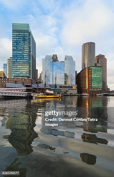 usa, massachusetts, boston, waterfront buildings reflecting in water - boston tea party stock pictures, royalty-free photos & images