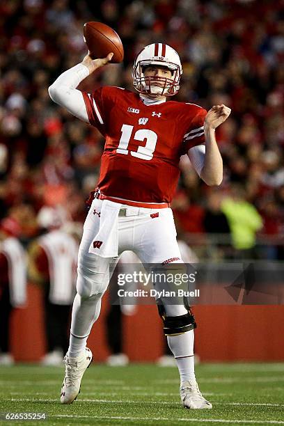 Bart Houston of the Wisconsin Badgers throws a pass in the third quarter against the Minnesota Golden Gophers at Camp Randall Stadium on November 26,...