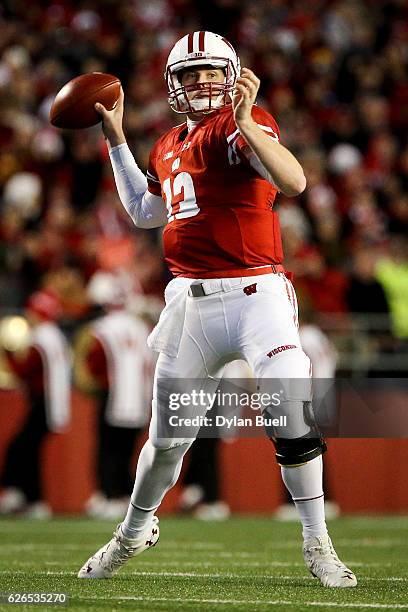 Bart Houston of the Wisconsin Badgers throws a pass in the third quarter against the Minnesota Golden Gophers at Camp Randall Stadium on November 26,...