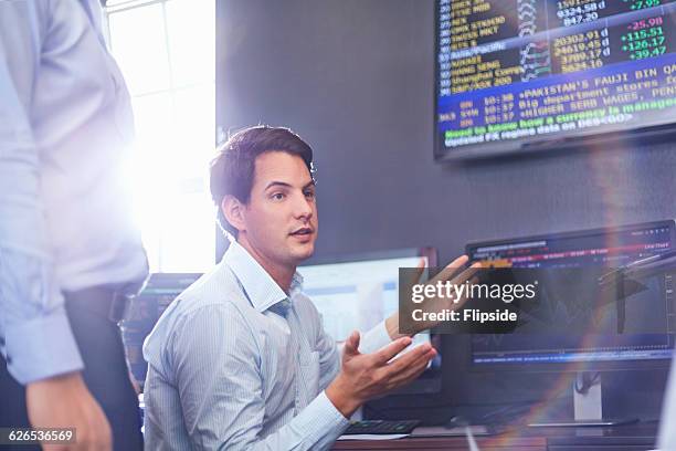 mid adult business man in office having discussion, hand gestures - financial analyst 個照片及圖片檔