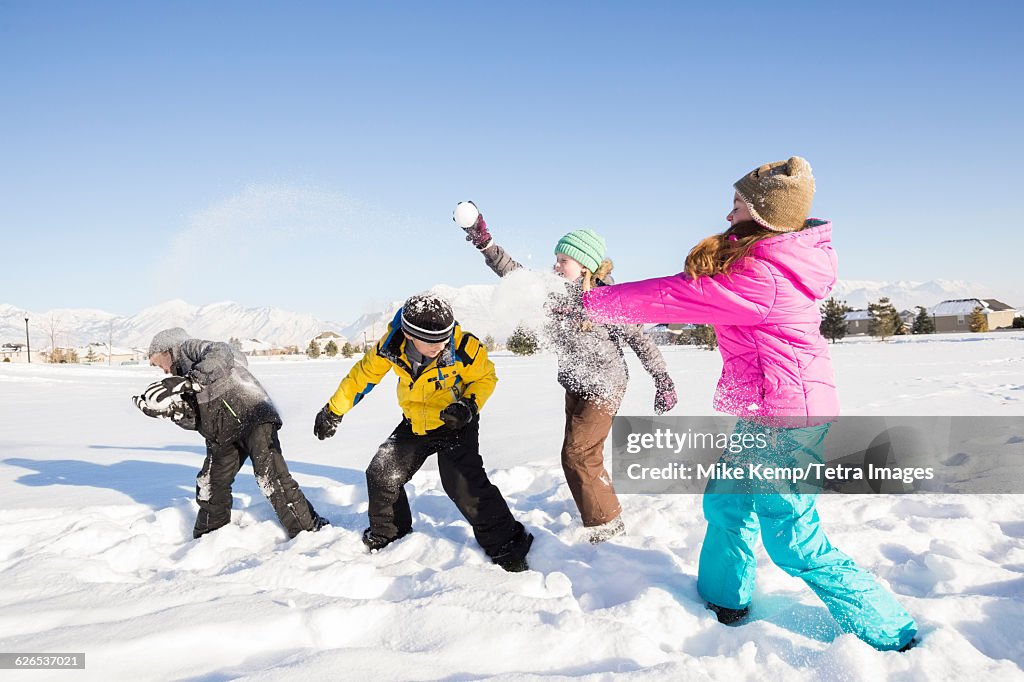 USA, Utah, Saratoga Springs, Children (8-9, 10-11) playing in snow