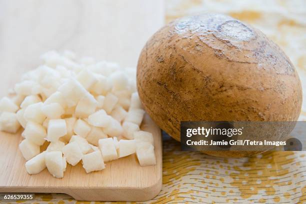 whole and chopped jicama - yam-bean stock pictures, royalty-free photos & images