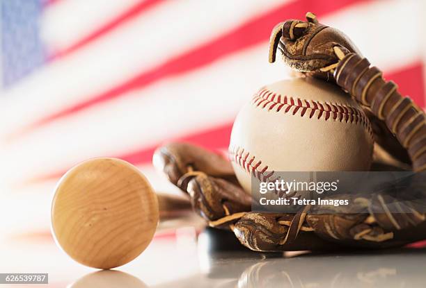 close-up of baseball glove, ball and bat - baseball bat and ball stock pictures, royalty-free photos & images