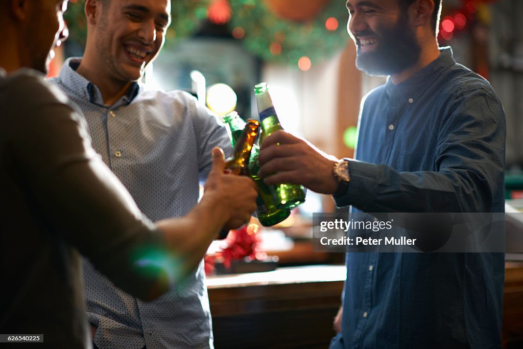 Friends in public house making a toast