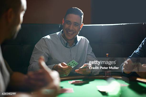 man dealing playing cards for game at pub card table - dela ut kort bildbanksfoton och bilder