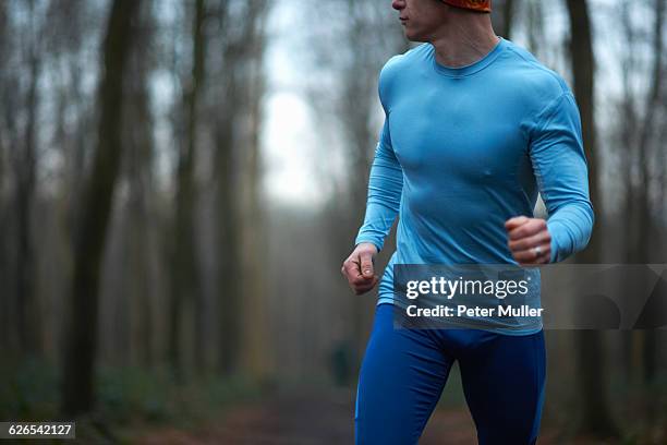 cropped view of runner wearing spandex looking away - spandex stockfoto's en -beelden