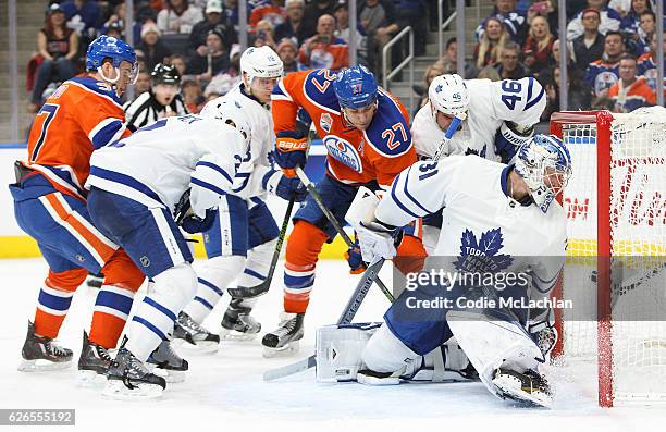 Milan Lucic of the Edmonton Oilers tries to put the puck behind goalie Frederik Andersen of the Toronto Maple Leafs on November 29, 2016 at Rogers...