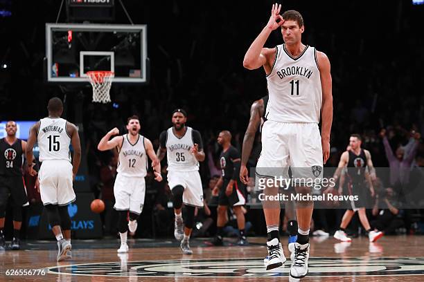 Brook Lopez of the Brooklyn Nets reacts after hitting a three pointer against the Los Angeles Clippers in the second half at Barclays Center on...