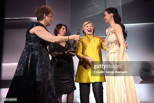 Caryl Stern, Pamela Fiori, and Hillary Clinton present the Audrey Hepburn Humanitarian Award to Honoree Katy Perry during the 12th annual UNICEF...