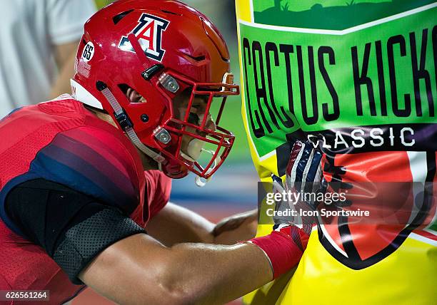 Arizona Wildcats tight end Trevor Wood warms up before the Cactus Kickoff Classic NCAA football game between the Brigham Young Cougars and the...