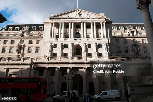 General view of the Bank of England with a dark stormy sky above with sun shining onto its front aspect on November 22, 2016 in London, United...
