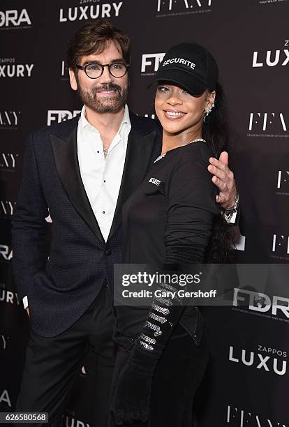 Editorial Director of Footwear News , Michael Atmore and event honoree Rihanna attend the 30th FN Achievement awards at IAC Headquarters on November...