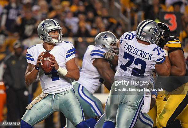 Quarterback Dak Prescott of the Dallas Cowboys looks to pass as center Travis Frederick blocks defensive lineman Stephon Tuitt of the Pittsburgh...