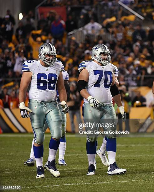 Tackle Doug Free and guard Zack Martin of the Dallas Cowboys walk to the line of scrimmage during a game against the Pittsburgh Steelers at Heinz...
