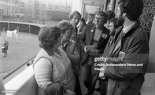 Sinn Fein MPs Owen Carron and Gerry Adams along with Christy Burke, their candidate in Dublin Central, share a joke with some of the residents of...