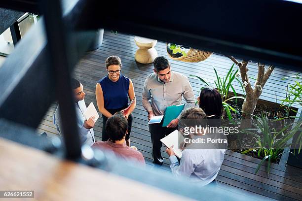 business people discussing at lobby - overhead view bildbanksfoton och bilder