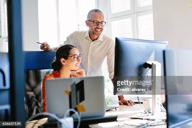 computer programmers working together - desktop pc stock pictures, royalty-free photos & images