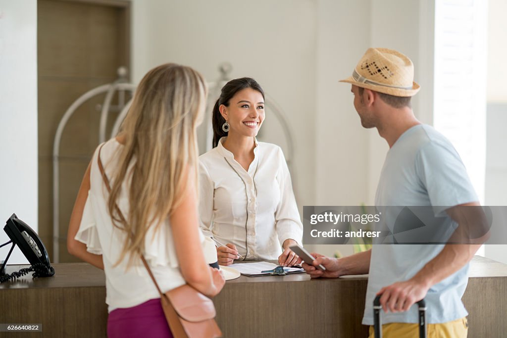 Hostess doing the check-in of a couple