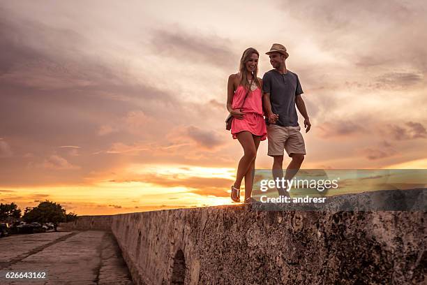 romantic couple traveling and enjoying the sunset - cartagena colombia stock pictures, royalty-free photos & images