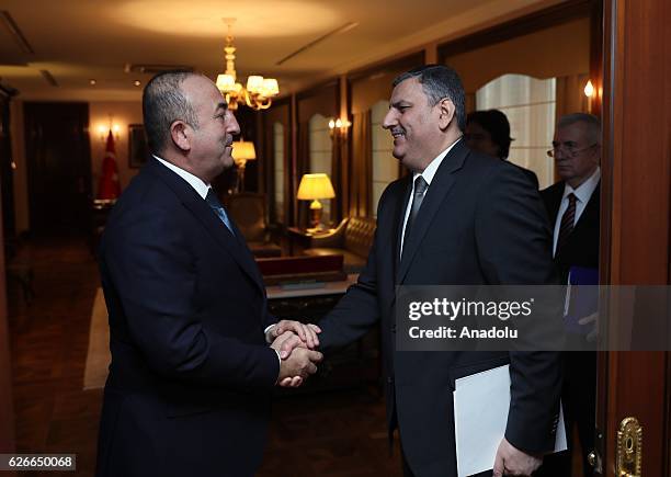 Turkish Foreign Minister Mevlut Cavusoglu meets Former Syrian Prime Minister Riyad Farid Hijab in Ankara, Turkey on November 30, 2016.