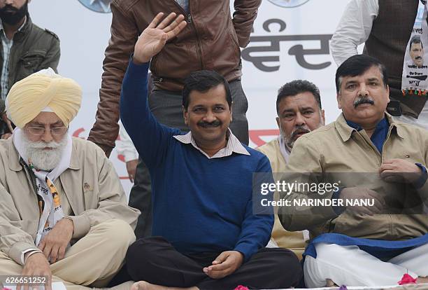 Indian leader of the Aam Aadmi Party and Chief Minister of Delhi Arvind Kejriwal and AAP leaders Inderbir Singh Nijjar and Sanjay Singh pose for a...